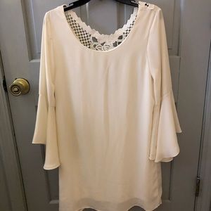 White flowy dress with bell sleeves